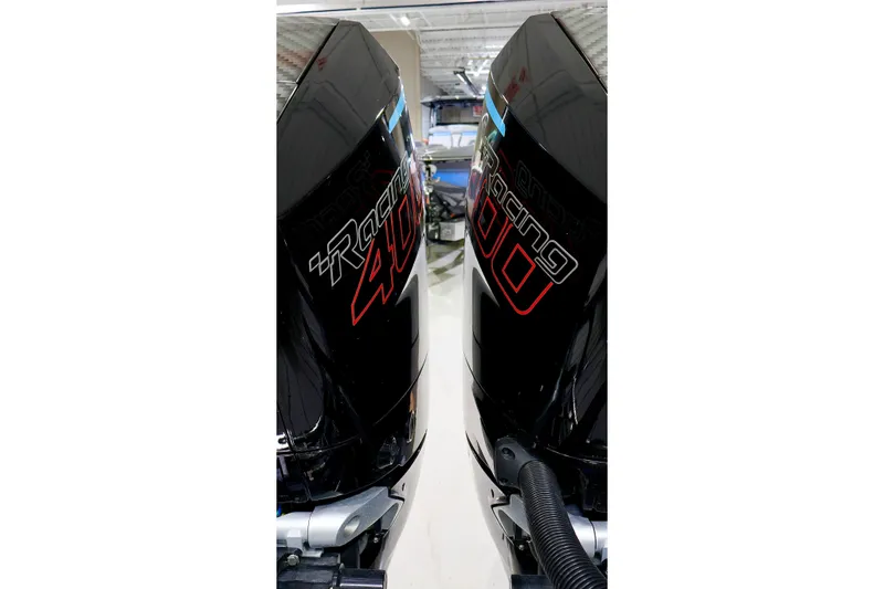 Slide: The Image of Twin Mercury Racing 400 outboard engines on a 2025 Sunsation 32 CCX boat. - 14