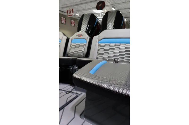 Slide: The Image of 2025 Sunsation 32 CCX boat interior with modern seating and blue accents. - 19