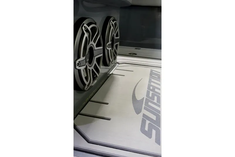 Slide: The Image of 2025 Sunsation 32 CCX boat interior with branded flooring and dual speakers. - 22