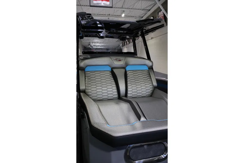 Slide: The Image of 2025 Sunsation 32 CCX boat interior with modern, textured seating design. - 32