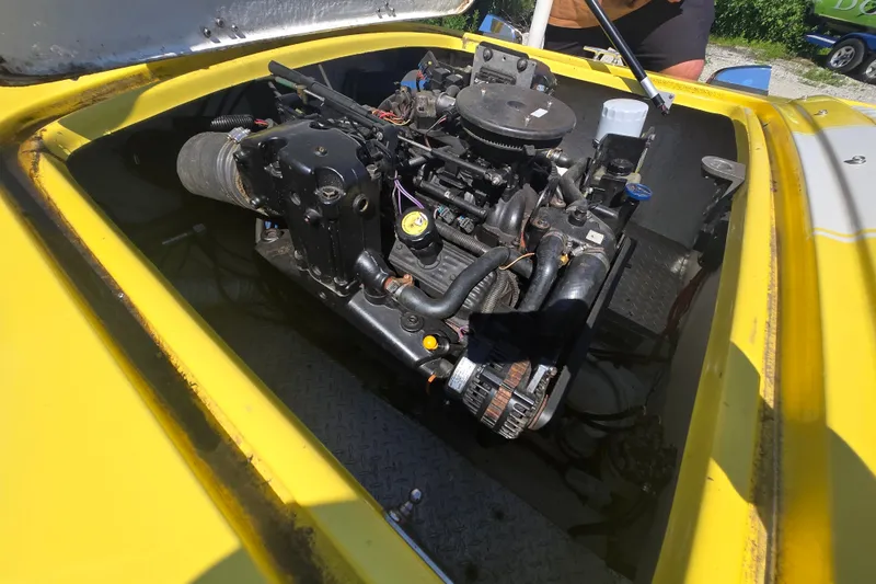 Slide: The Image of Engine compartment of a 1994 Donzi 18 Classic boat, showcasing detailed mechanical components. - 4