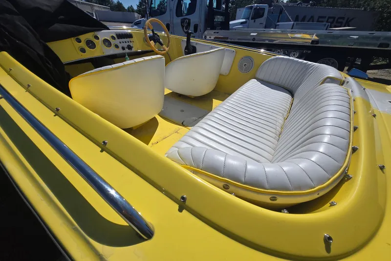 Slide: The Image of Yellow 1994 Donzi 18 Classic boat interior with white seating and dashboard. - 3