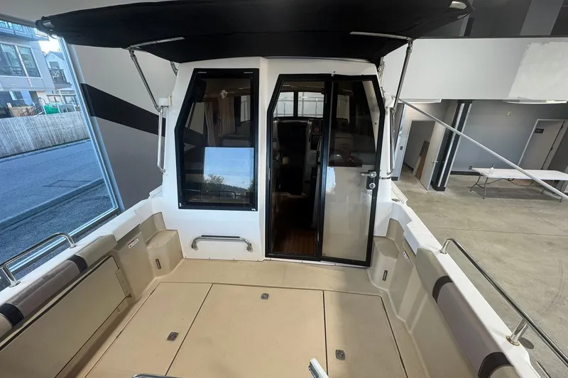 Slide: The Image of 2018 Ranger Tugs R-23 boat interior with open cockpit and canopy. - 9