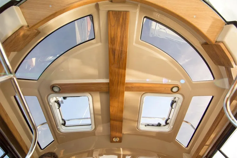 Slide: The Image of Manufacturer Provided Image: 2018 Ranger Tugs R-23 cabin ceiling with skylights and wooden accents. - 4