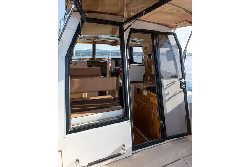 Slide: The Image of Manufacturer Provided Image: 2018 Ranger Tugs R-23 boat interior with seating and cabinetry. - 3