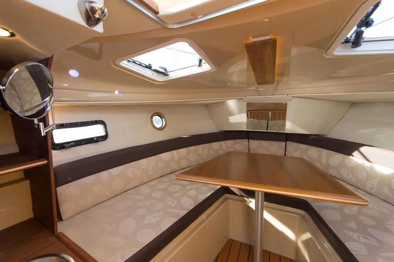 Slide: The Image of Manufacturer Provided Image: 2018 Ranger Tugs R-23 cabin interior with dining table and seating. - 6