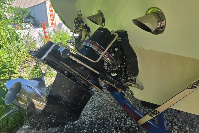 Slide: The Image of 1998 Donzi 28 ZX boat with MerCruiser outdrive, parked on gravel. - 4