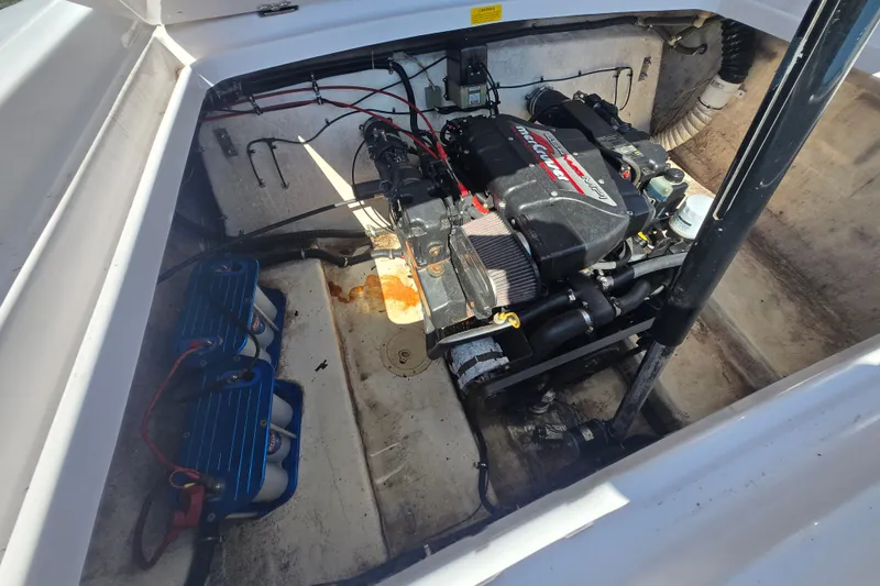 Slide: The Image of Engine compartment of a 1998 Donzi 28 ZX boat, featuring a powerful engine setup. - 22