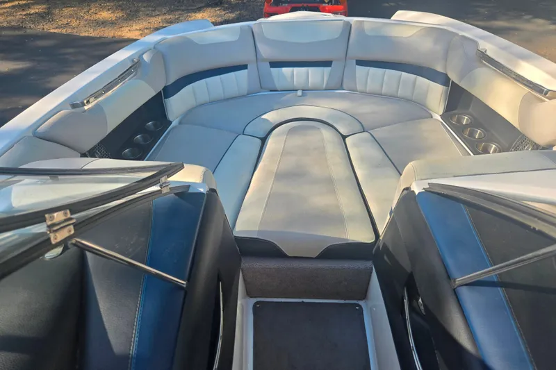 Slide: The Image of Interior of a 2013 Malibu Wakesetter 24 MXZ boat with spacious seating. - 9