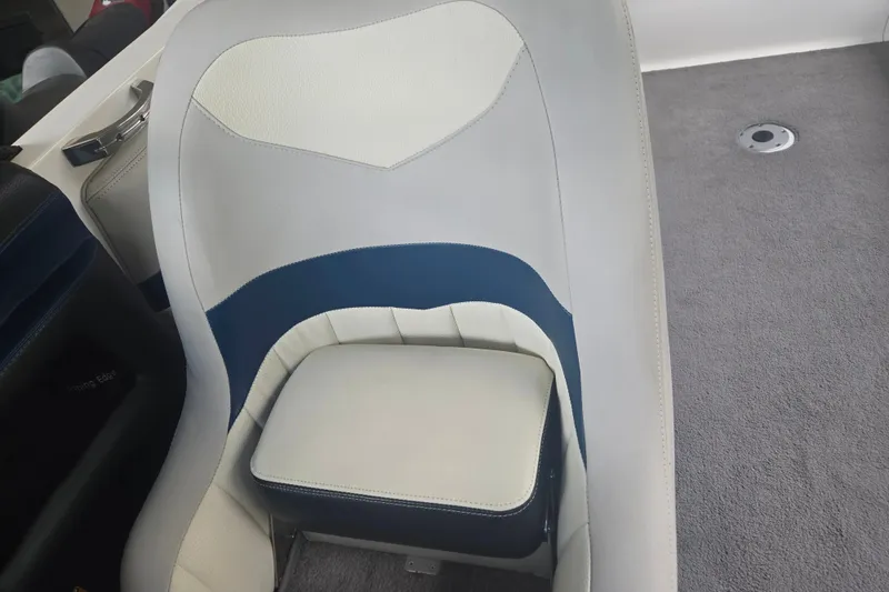 Slide: The Image of 2013 Malibu Wakesetter 24 MXZ boat seat with blue and white upholstery. - 29