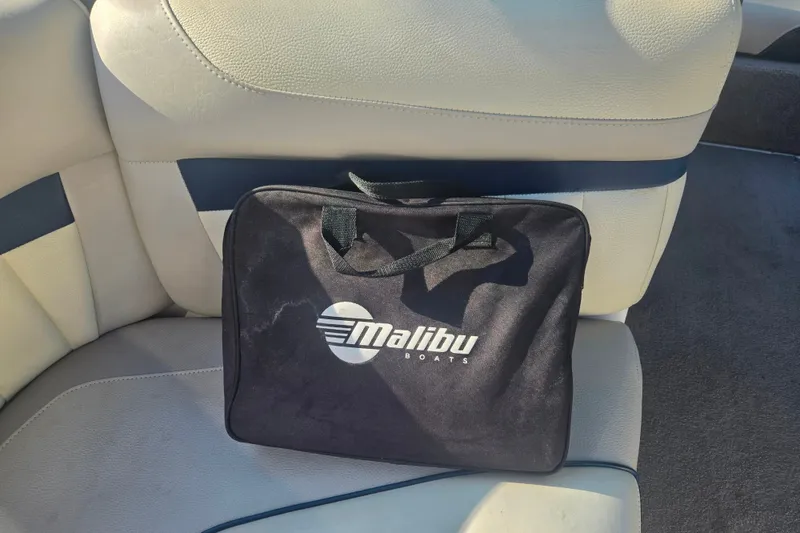 Slide: The Image of Black Malibu Boats bag on a 2013 Wakesetter 24 MXZ seat. - 13