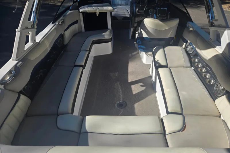 Slide: The Image of Interior of a 2013 Malibu Wakesetter 24 MXZ boat with spacious seating. - 6