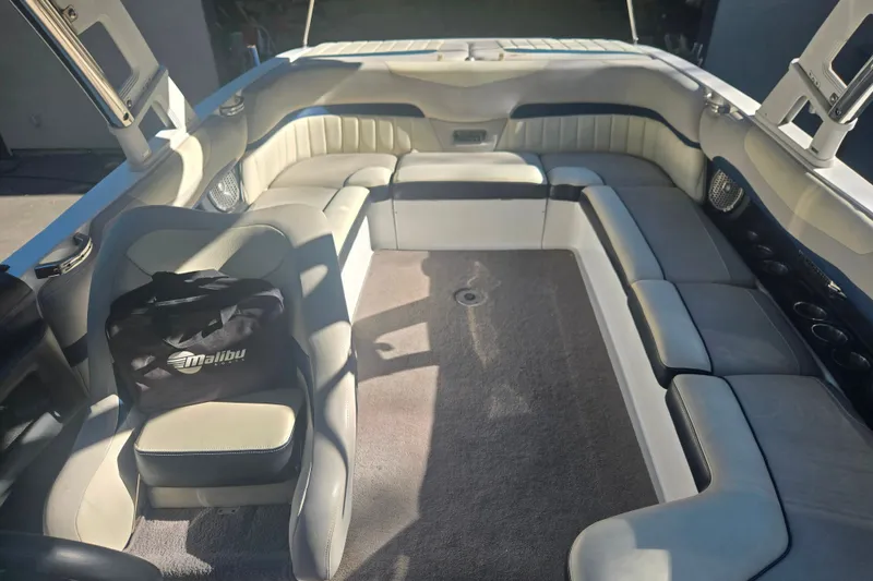 Slide: The Image of Interior of 2013 Malibu Wakesetter 24 MXZ boat with spacious seating and Malibu bag. - 10