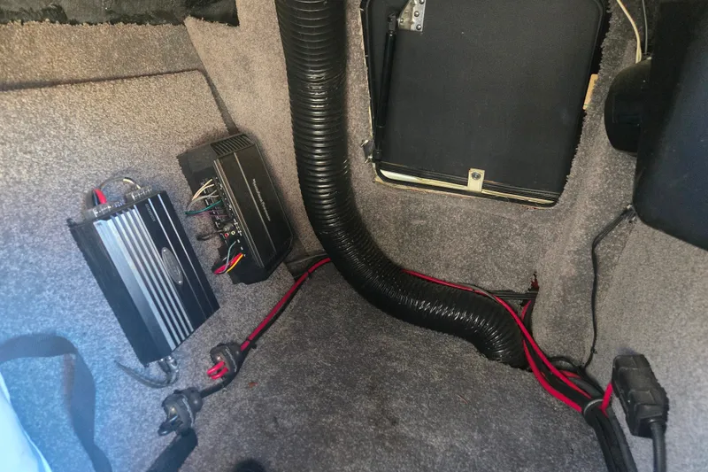 Slide: The Image of 2013 Malibu Wakesetter 24 MXZ interior wiring and amplifier setup. - 7