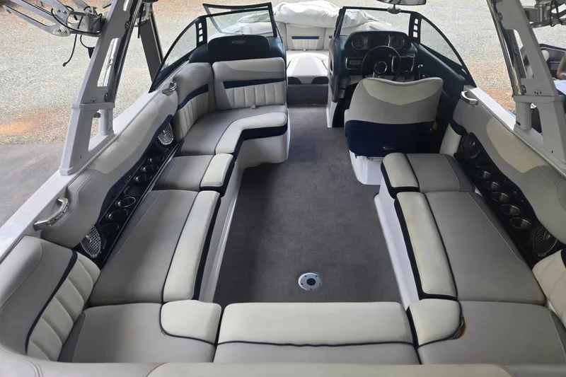 Slide: The Image of 2013 Malibu Wakesetter 24 MXZ interior with spacious seating and modern design. - 31
