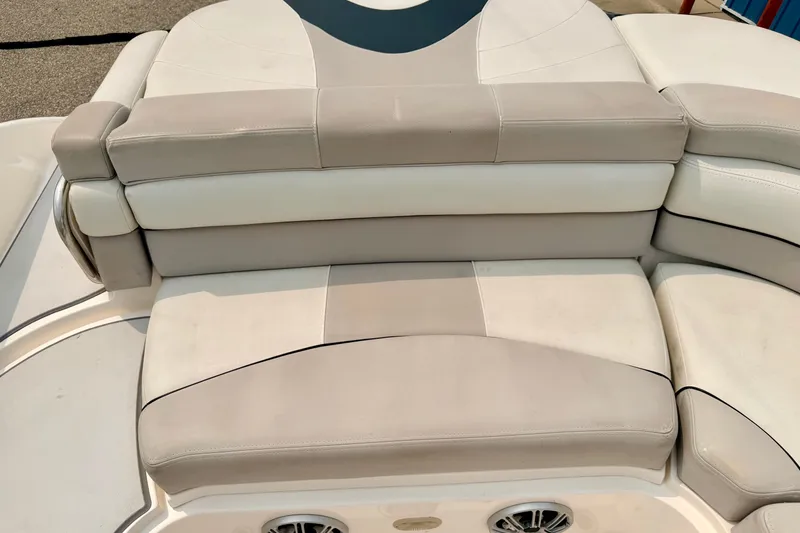 Slide: The Image of Luxurious seating on a 2012 Bryant 268 boat, featuring beige and white upholstery. - 35