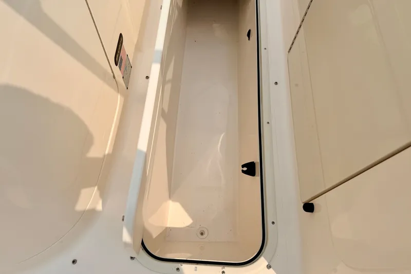 Slide: The Image of Storage compartment of a 2012 Bryant 268 boat, featuring a clean, spacious interior. - 71
