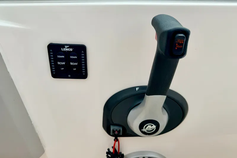 Slide: The Image of Boat throttle control and Lenco trim tab switch on a 2012 Bryant 268. - 58