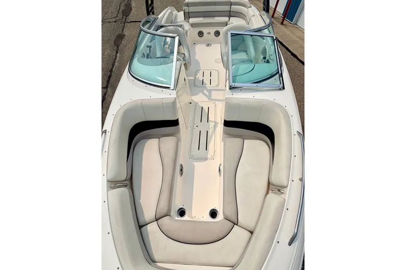 Slide: The Image of 2012 Bryant 268 boat interior with spacious seating and open windshield design. - 84