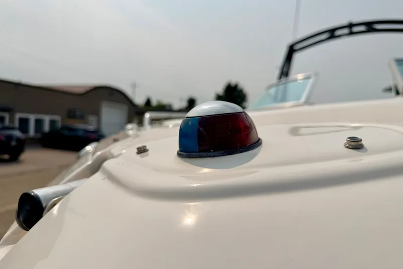 Slide: The Image of Close-up of a 2012 Bryant 268 boat's navigation light on deck. - 102