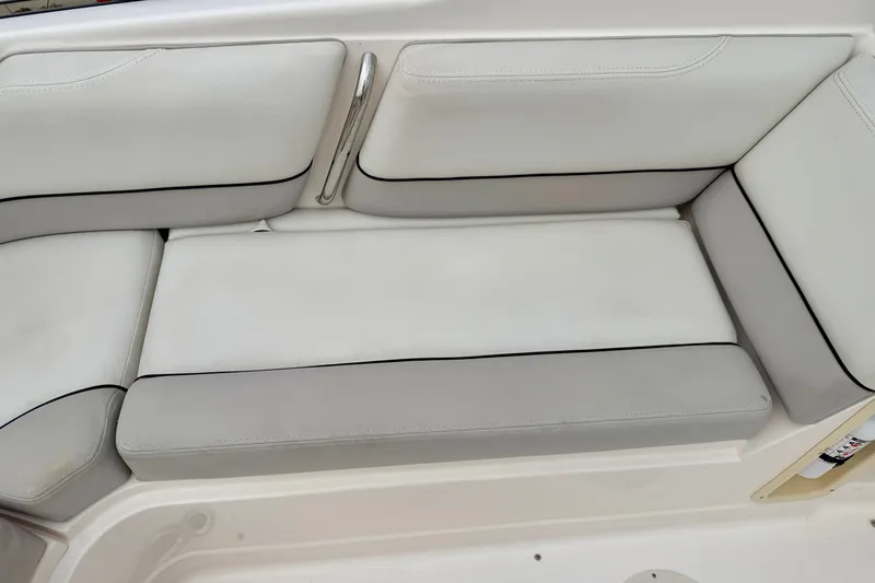 Slide: The Image of White and gray seating on a 2012 Bryant 268 boat, featuring sleek design and comfort. - 40