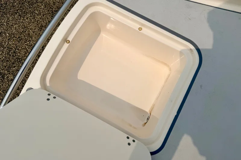 Slide: The Image of Open storage compartment on a 2012 Bryant 268 boat, showcasing interior space. - 25