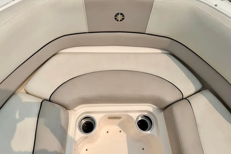Slide: The Image of Luxurious seating area on a 2012 Bryant 268 boat with cup holders. - 79