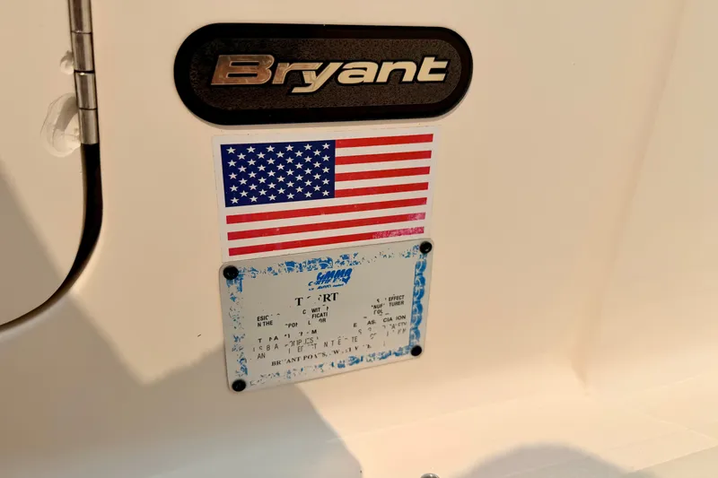 Slide: The Image of Bryant 268 boat emblem with American flag and informational plate, 2012 model. - 99