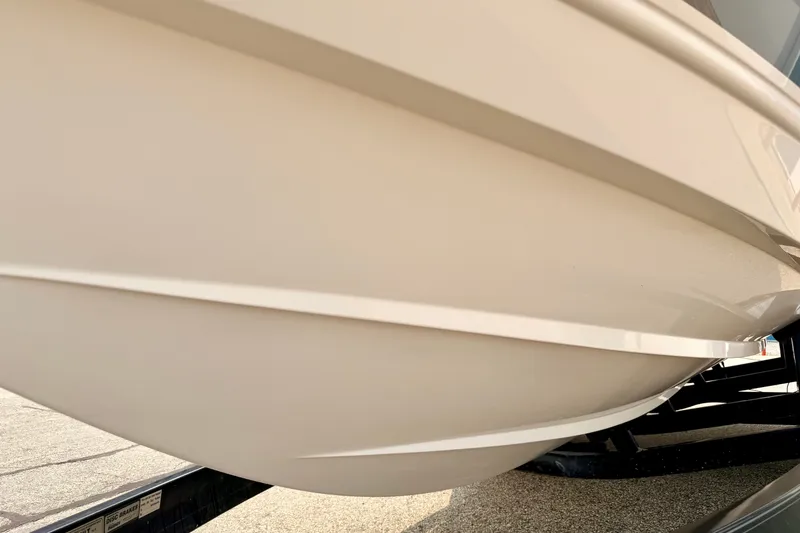Slide: The Image of Close-up of a 2012 Bryant 268 boat hull on a trailer. - 104