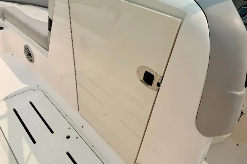 Slide: The Image of Interior view of a 2012 Bryant 268 boat, featuring seating and storage compartment. - 72