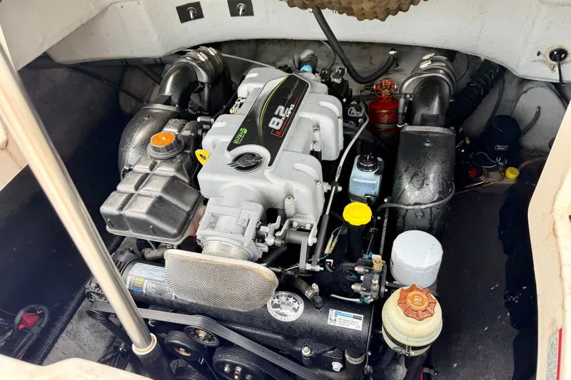 Slide: The Image of Engine compartment of a 2012 Bryant 268 boat, showcasing detailed mechanical components. - 36