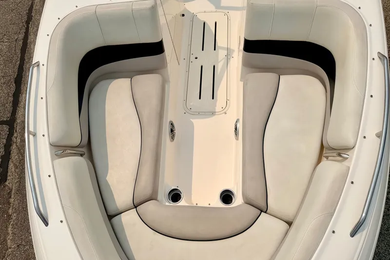 Slide: The Image of 2012 Bryant 268 boat interior with beige seating and sleek design. - 85
