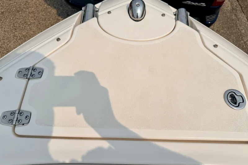 Slide: The Image of Bow of a 2012 Bryant 268 boat with stainless steel fittings and textured surface. - 82
