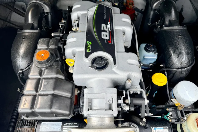 Slide: The Image of Engine of a 2012 Bryant 268 boat, featuring a MerCruiser 8.2 MAG motor. - 37