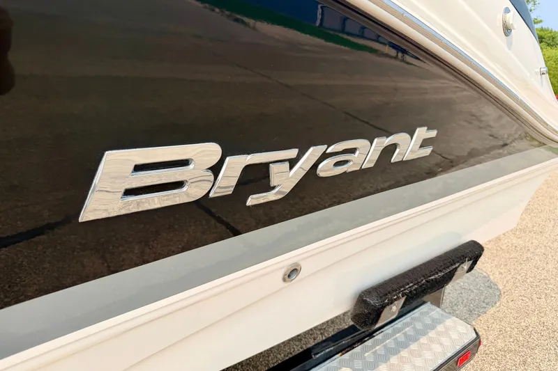 Slide: The Image of 2012 Bryant 268 boat logo on sleek black exterior. - 13