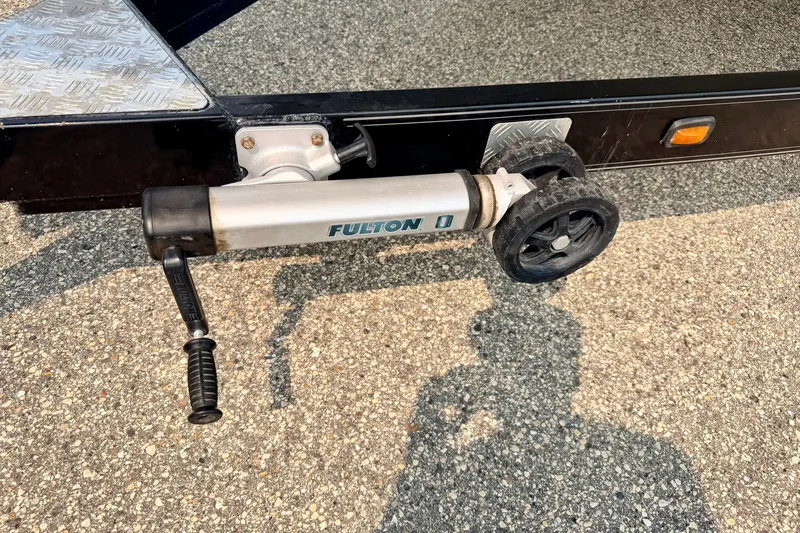 Slide: The Image of Trailer jack with Fulton branding on a Bryant 268, 2012 model, parked on asphalt. - 107