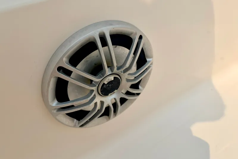Slide: The Image of Close-up of a speaker on a 2012 Bryant 268 boat, showcasing its sleek design. - 89