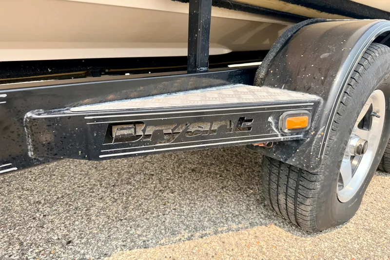 Slide: The Image of 2012 Bryant 268 trailer step with logo and tire detail. - 109