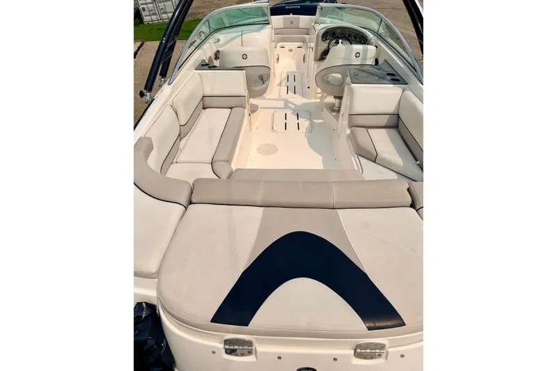 Slide: The Image of Interior view of a 2012 Bryant 268 boat with spacious seating and helm. - 94