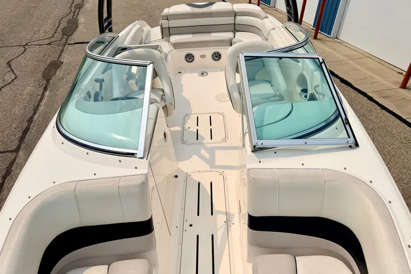Slide: The Image of 2012 Bryant 268 boat interior with open windshield and white seating. - 86