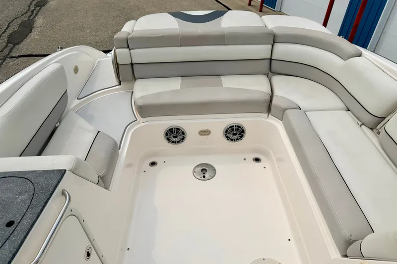Slide: The Image of Interior seating of a 2012 Bryant 268 boat with white and gray upholstery. - 32