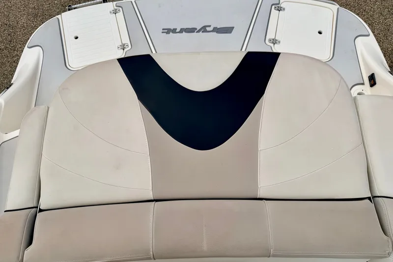 Slide: The Image of Rear seating area of a 2012 Bryant 268 boat, featuring stylish upholstery design. - 23