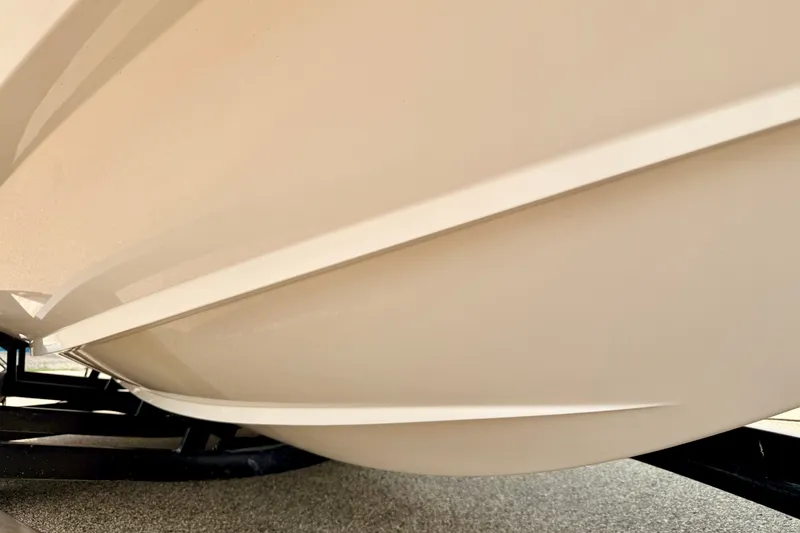 Slide: The Image of Close-up of a 2012 Bryant 268 boat hull, showcasing sleek design and craftsmanship. - 103