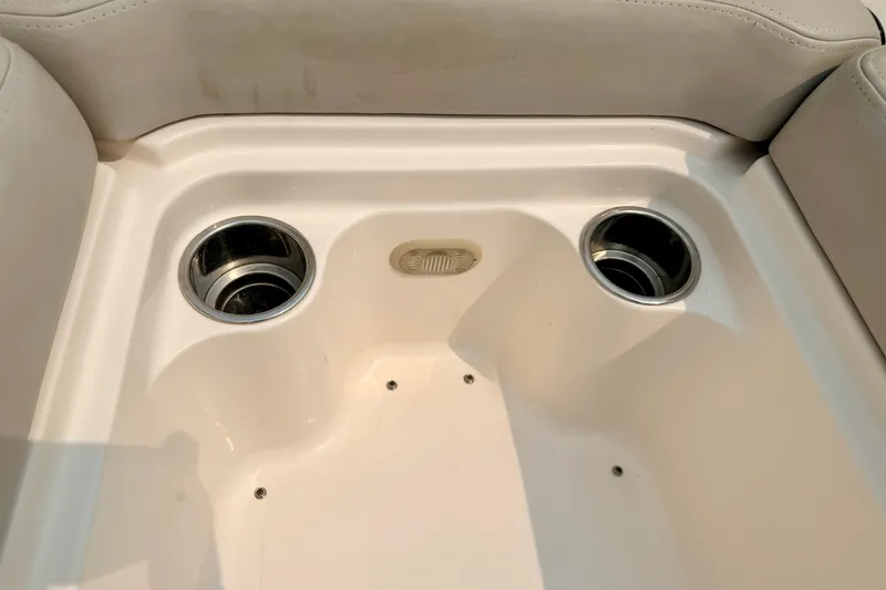 Slide: The Image of Interior of a 2012 Bryant 268 boat with dual cup holders. - 87