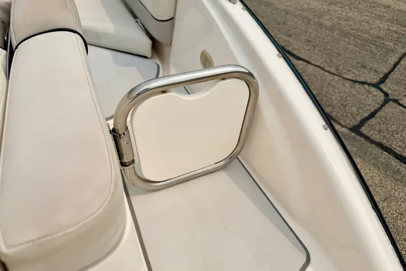Slide: The Image of Interior of a 2012 Bryant 268 boat showing seating and a small gate. - 31