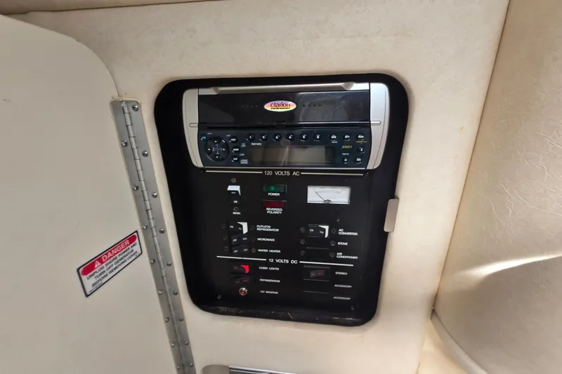 Slide: The Image of Electrical control panel inside a 2001 Sea Ray Sundancer 260 boat cabin. - 20