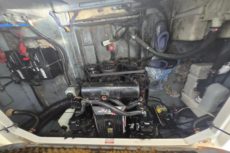 Slide: The Image of Engine compartment of a 2001 Sea Ray Sundancer 260 boat, featuring a Mercury engine. - 19