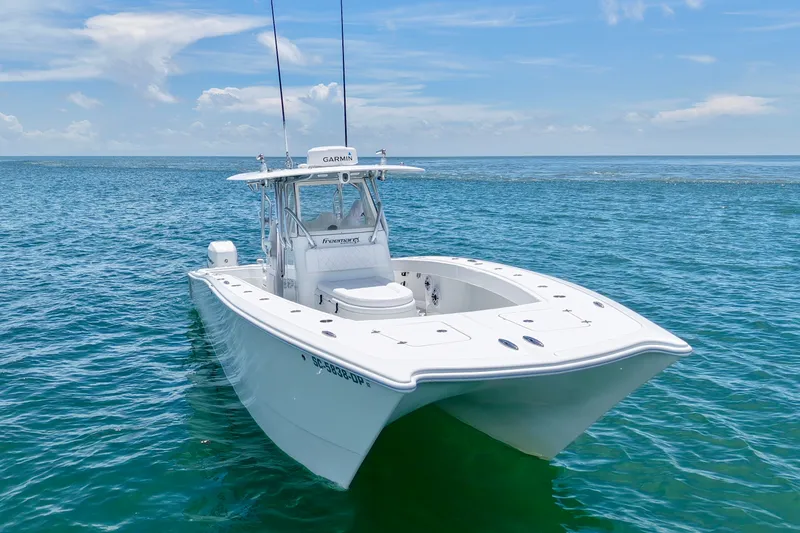 Slide: The Image of 2018 Freeman 34VH boat on open ocean under clear blue sky. - 21