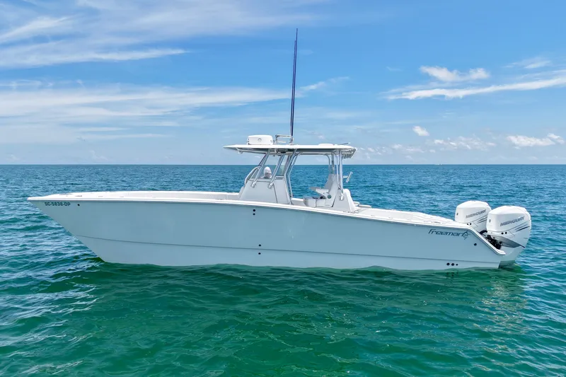 Slide: The Image of 2018 Freeman 34VH boat on open sea under clear blue sky. - 31