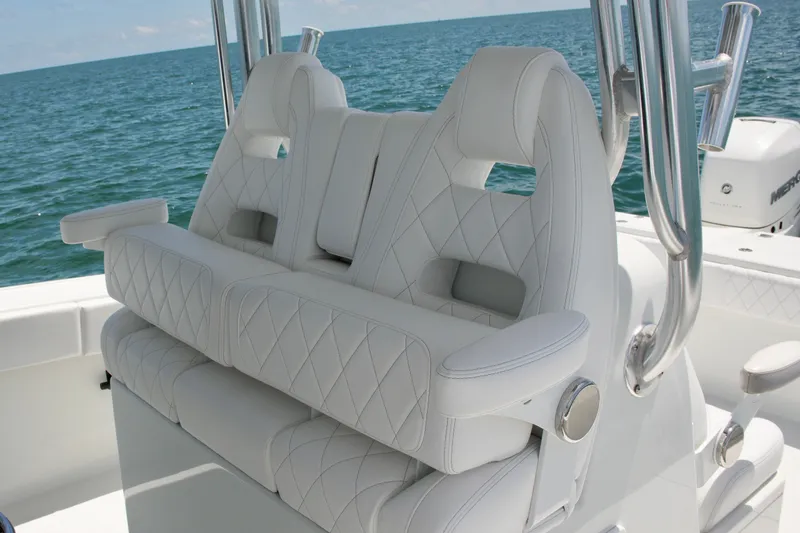 Slide: The Image of Luxurious white seating on a 2018 Freeman 34VH boat, overlooking the ocean. - 47
